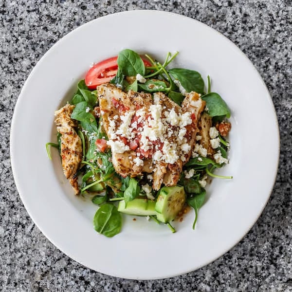 Demitris Taverna's Greek salad with grilled chicken, spinach, tomatoes, cucumbers, and feta cheese.